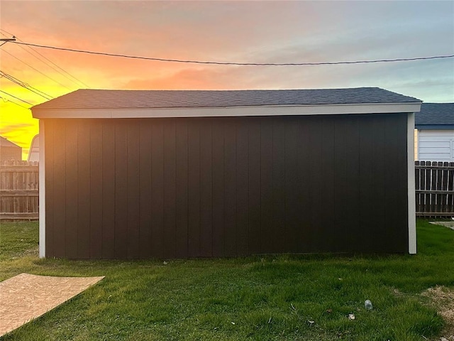 outdoor structure at dusk with a yard