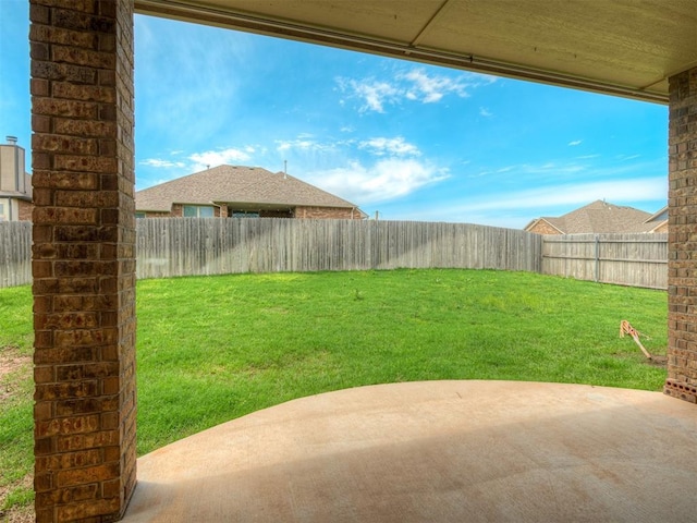 view of yard with a patio and a fenced backyard