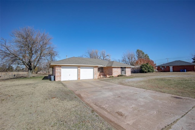 view of front facade featuring a garage and a front lawn