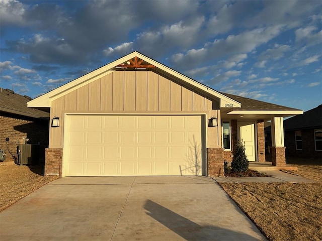 view of front of house with cooling unit and a garage