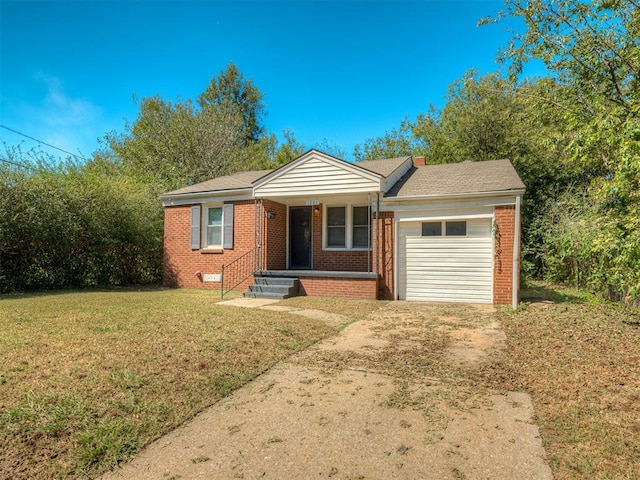 ranch-style home with a garage and a front lawn