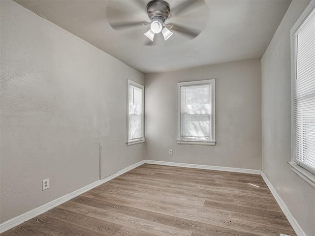 unfurnished room with ceiling fan and light hardwood / wood-style flooring