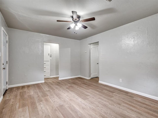 unfurnished bedroom featuring ceiling fan and light hardwood / wood-style flooring