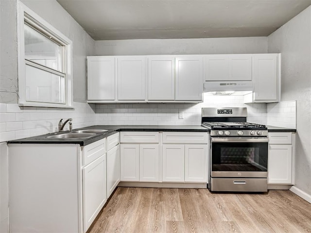 kitchen featuring white cabinetry, stainless steel range with gas cooktop, sink, and light wood-type flooring