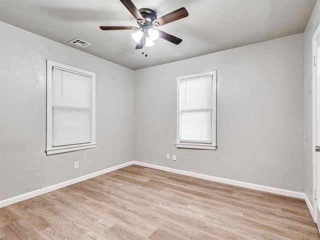 unfurnished room with light wood-type flooring and ceiling fan