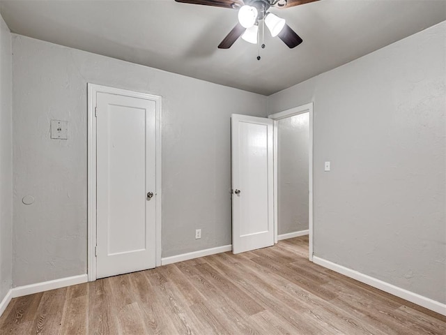 unfurnished bedroom featuring ceiling fan and light hardwood / wood-style flooring