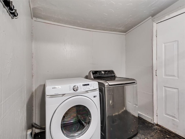 laundry area featuring washing machine and clothes dryer