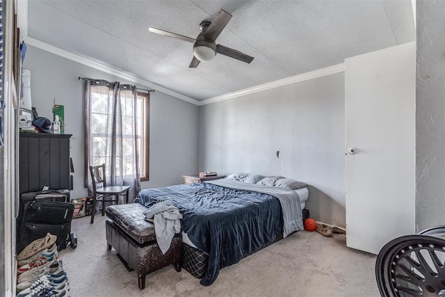 bedroom featuring light carpet, crown molding, ceiling fan, and a textured ceiling