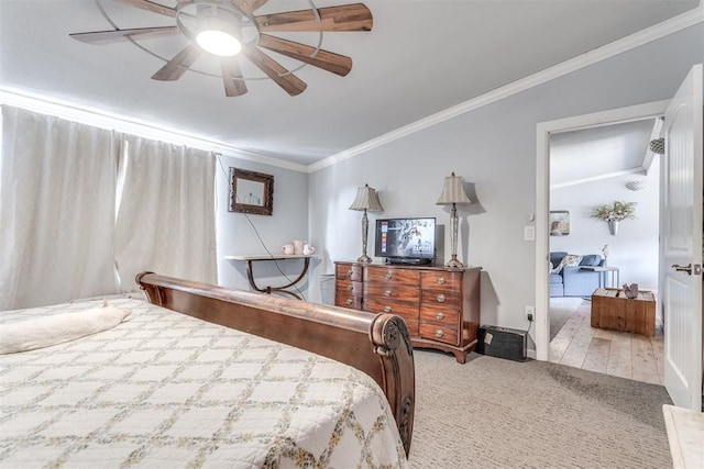 bedroom with ceiling fan, light hardwood / wood-style floors, and ornamental molding