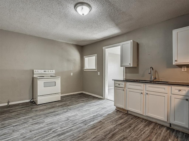 kitchen with white electric range oven, white cabinetry, sink, and dark wood-type flooring