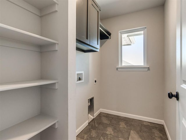 laundry area with baseboards, washer hookup, cabinet space, and hookup for an electric dryer