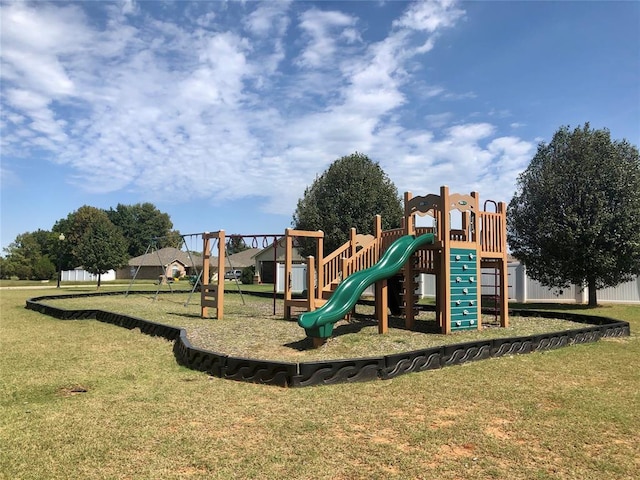 community jungle gym with a yard