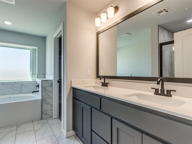 full bathroom with recessed lighting, marble finish floor, visible vents, and a sink