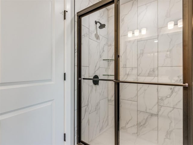 full bath with a marble finish shower