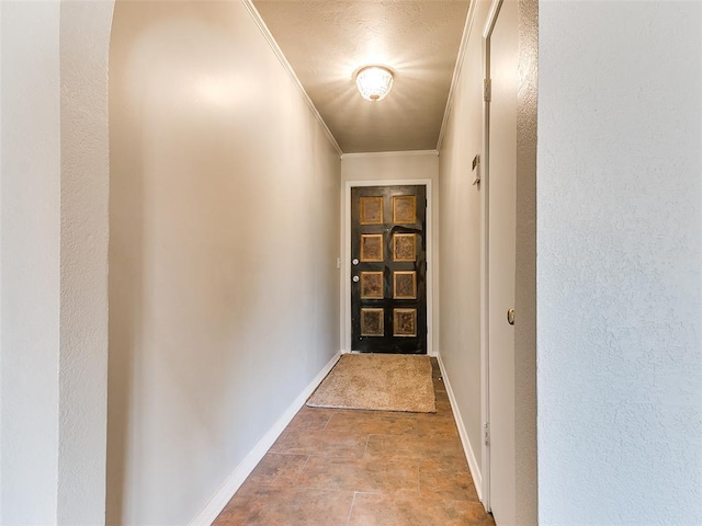 entryway featuring ornamental molding