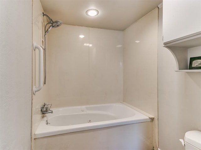 bathroom featuring toilet and shower / washtub combination