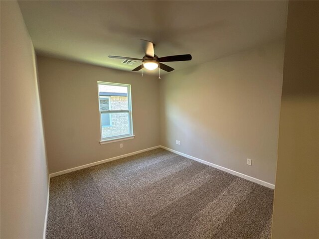 unfurnished room featuring carpet flooring and ceiling fan