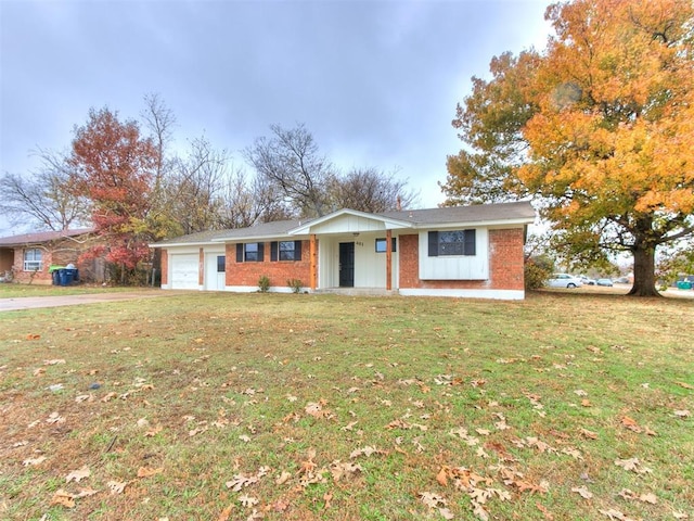 single story home featuring a garage and a front yard