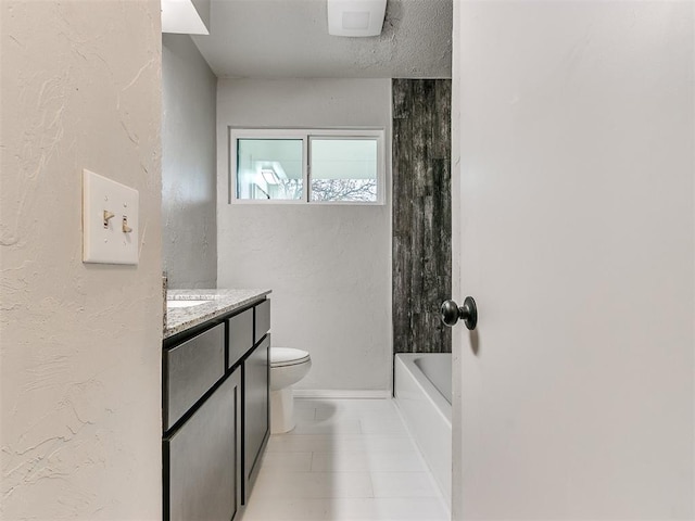 bathroom with tile patterned flooring, vanity, and toilet