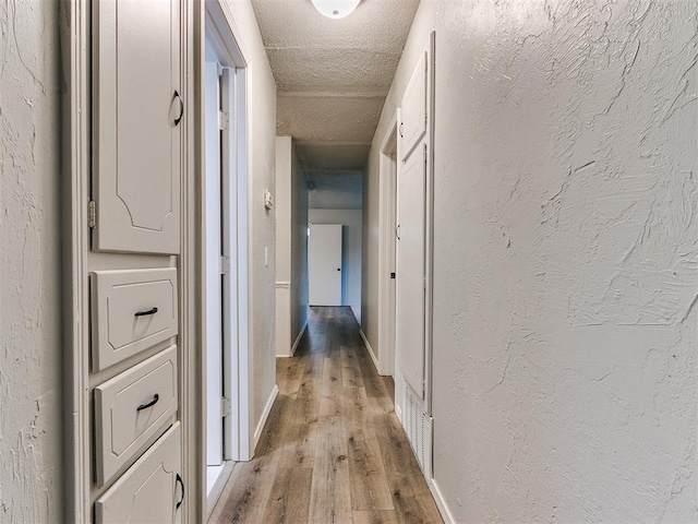 hall with light hardwood / wood-style floors