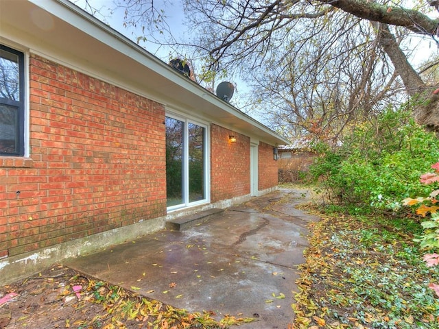 view of property exterior featuring a patio