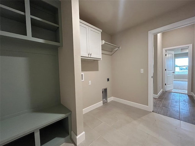 clothes washing area with hookup for an electric dryer and cabinets