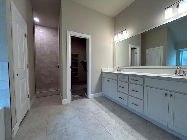 bathroom featuring vanity and an enclosed shower