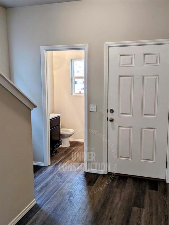 entryway with dark hardwood / wood-style floors