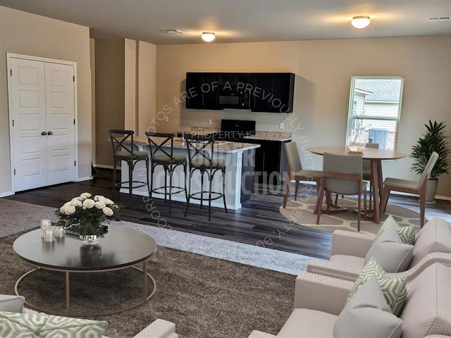 living room with dark wood-type flooring