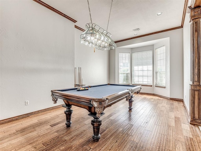 recreation room with ornamental molding, light wood-type flooring, and pool table