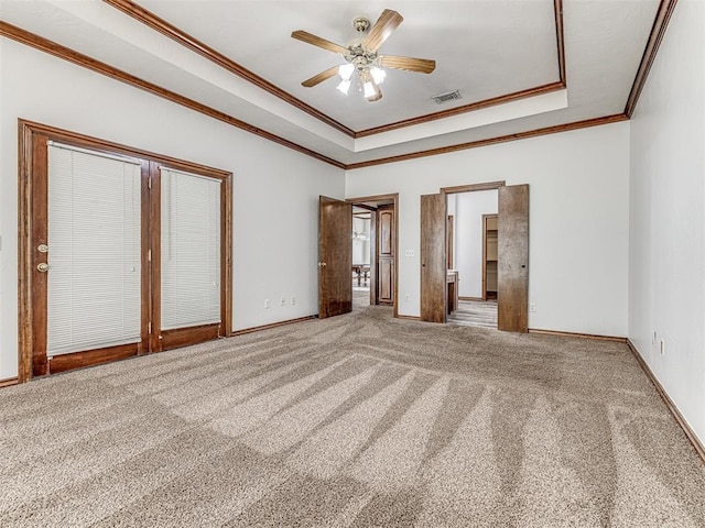 unfurnished bedroom with carpet flooring, ceiling fan, and crown molding