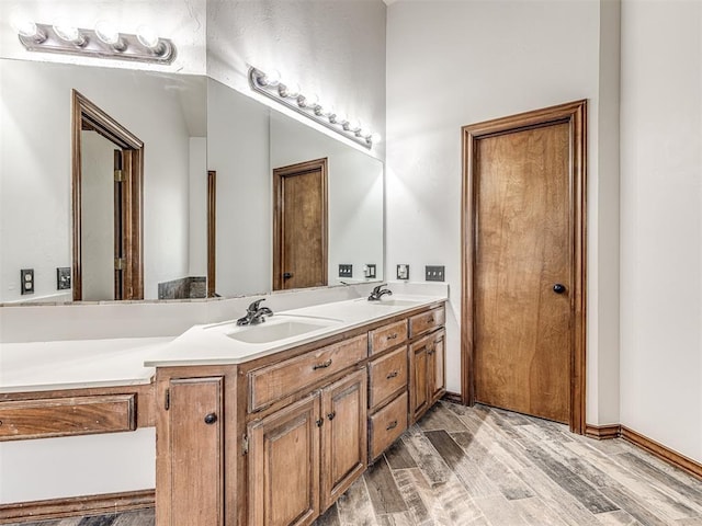 bathroom featuring vanity and hardwood / wood-style flooring