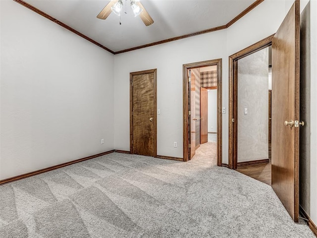 unfurnished bedroom featuring ceiling fan, carpet, and ornamental molding