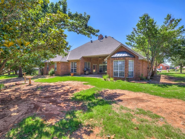 rear view of property with ceiling fan