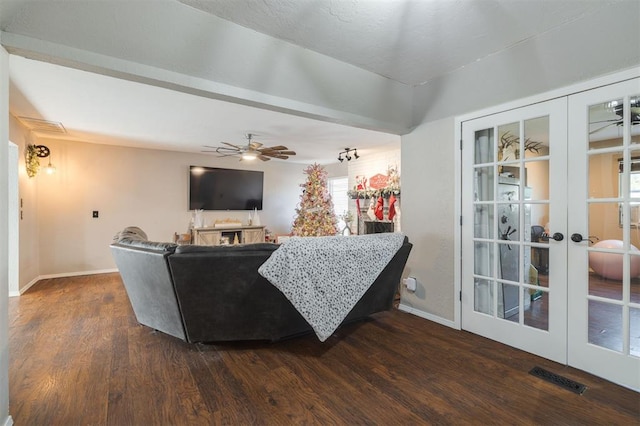 living room with french doors, dark hardwood / wood-style flooring, and ceiling fan