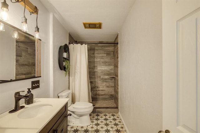 bathroom with a shower with shower curtain, vanity, toilet, and tile patterned flooring