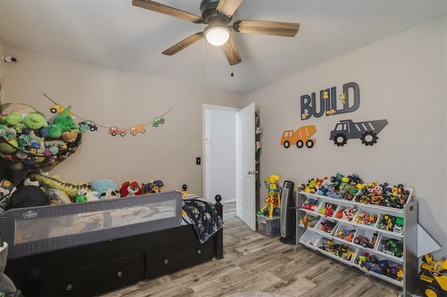 bedroom featuring hardwood / wood-style floors and ceiling fan