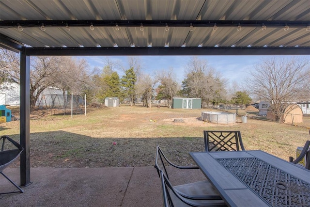 view of patio / terrace with a storage shed