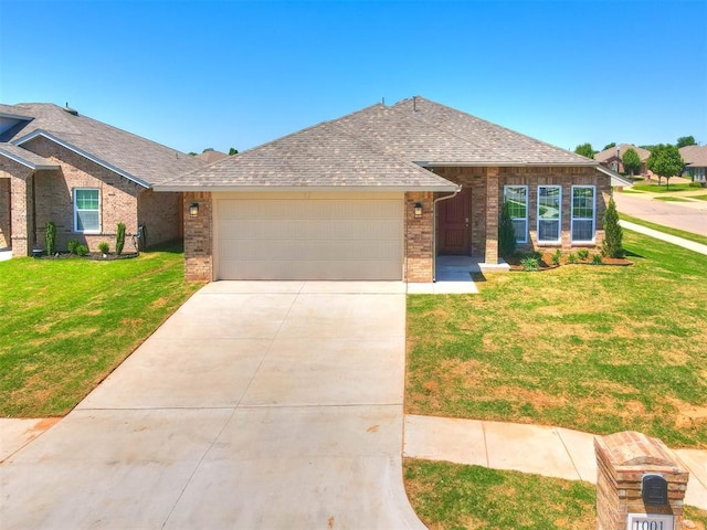 ranch-style home featuring a garage and a front lawn