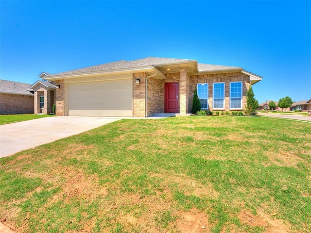 ranch-style house featuring a garage and a front lawn