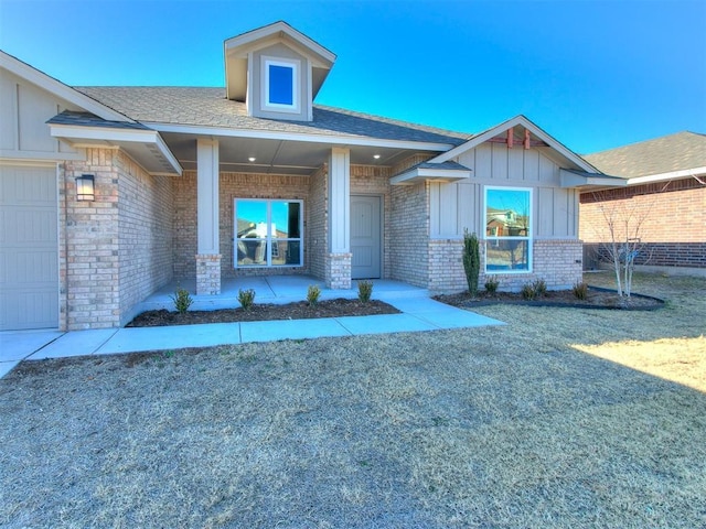 entrance to property with covered porch and a garage