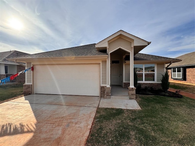 view of front of home with a garage and a front yard