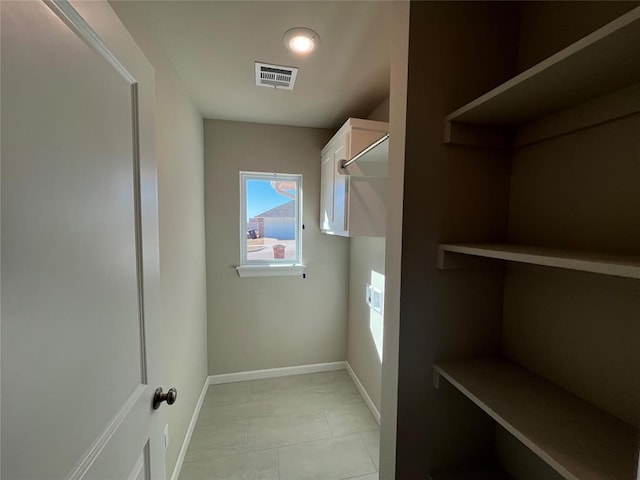 spacious closet featuring visible vents