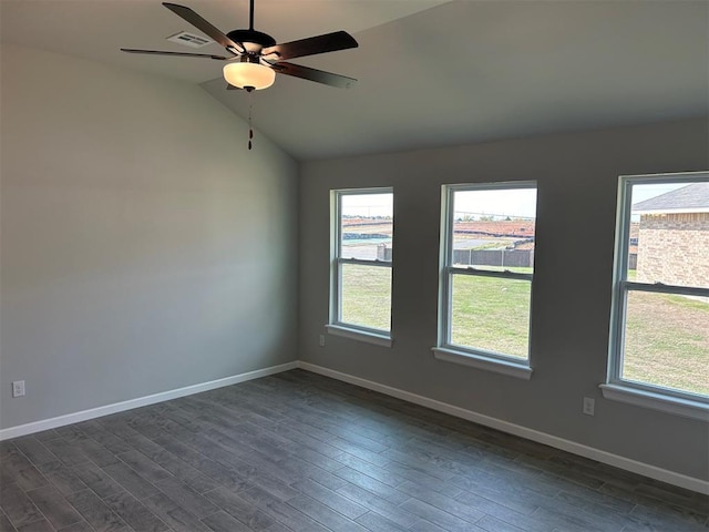 spare room with vaulted ceiling, ceiling fan, and dark hardwood / wood-style floors