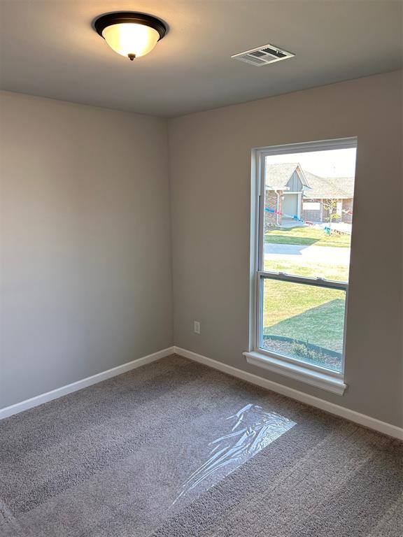 empty room featuring carpet flooring