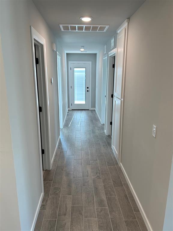 hallway featuring dark hardwood / wood-style floors