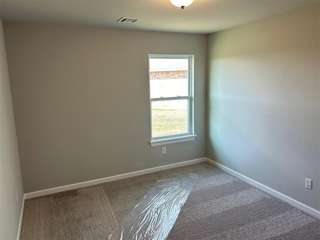 unfurnished room featuring carpet floors