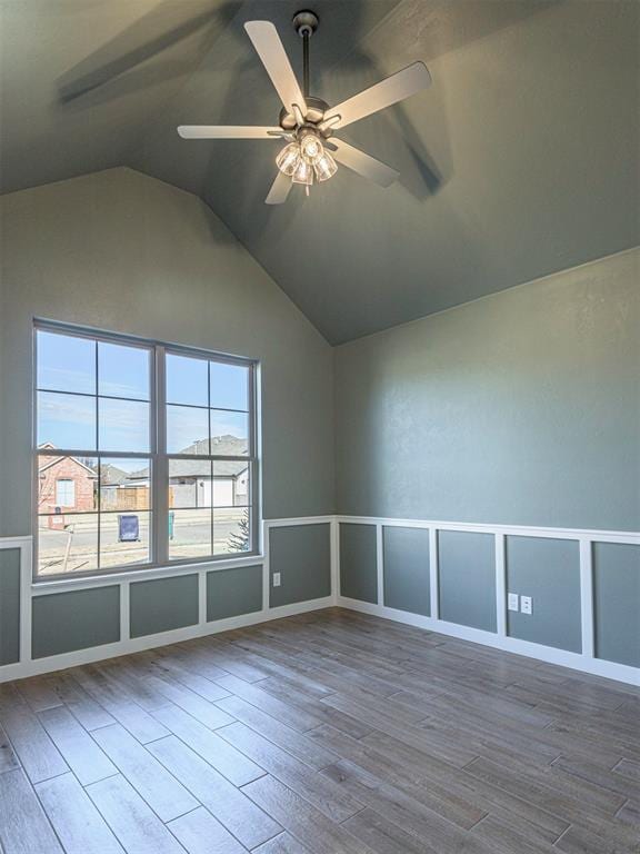 bonus room with a wealth of natural light, hardwood / wood-style flooring, ceiling fan, and lofted ceiling