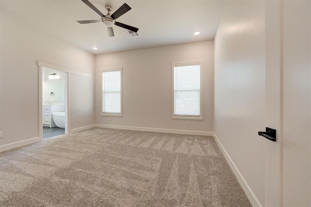 spare room with ceiling fan and carpet floors