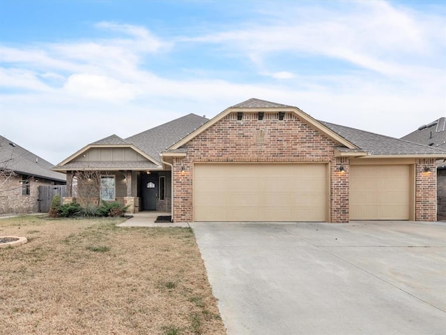 view of front facade with a garage and a front lawn